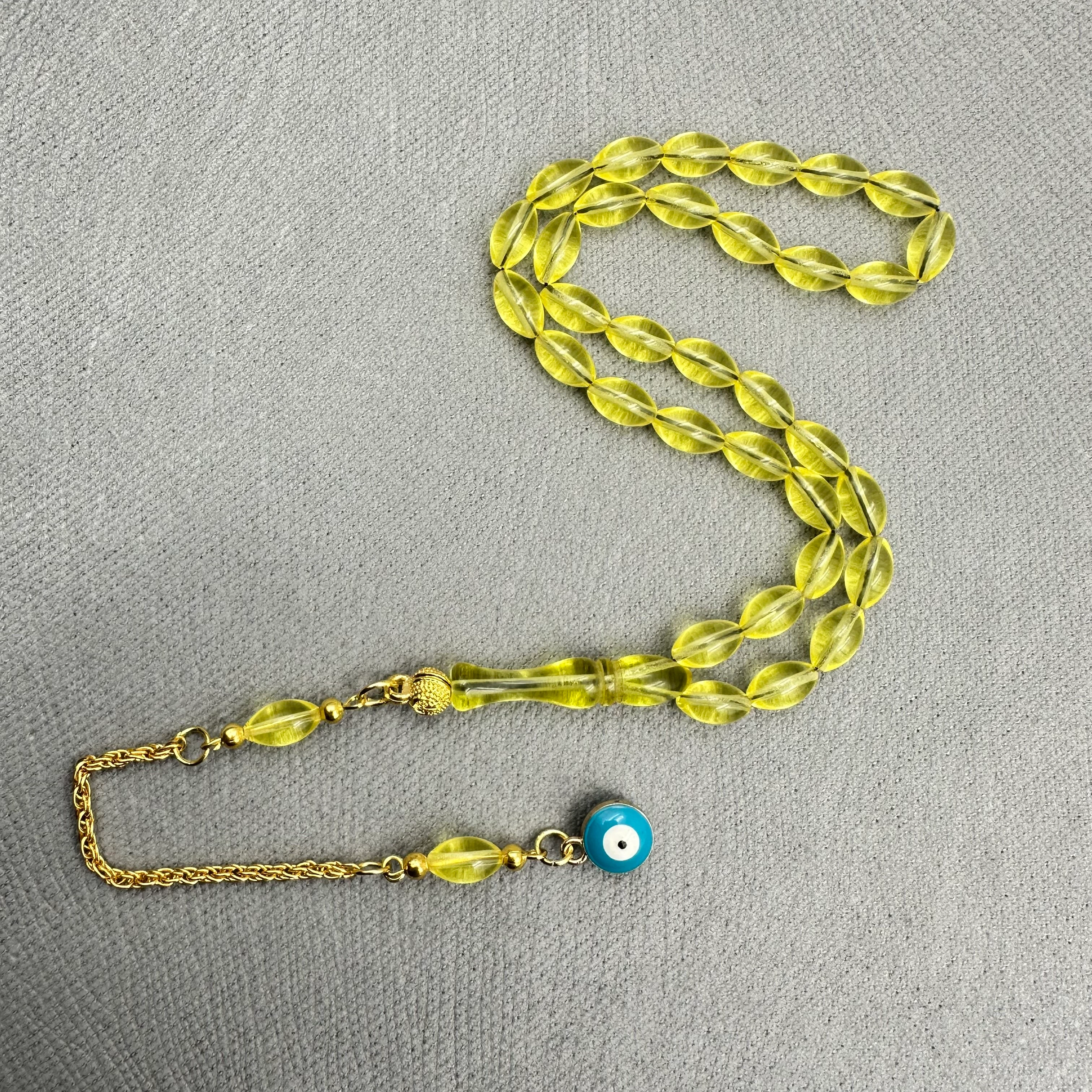 Pirinç Püsküllü Nazar Boncuğu Detaylı Bilek Boy Sarı Uçak Camı Tespih